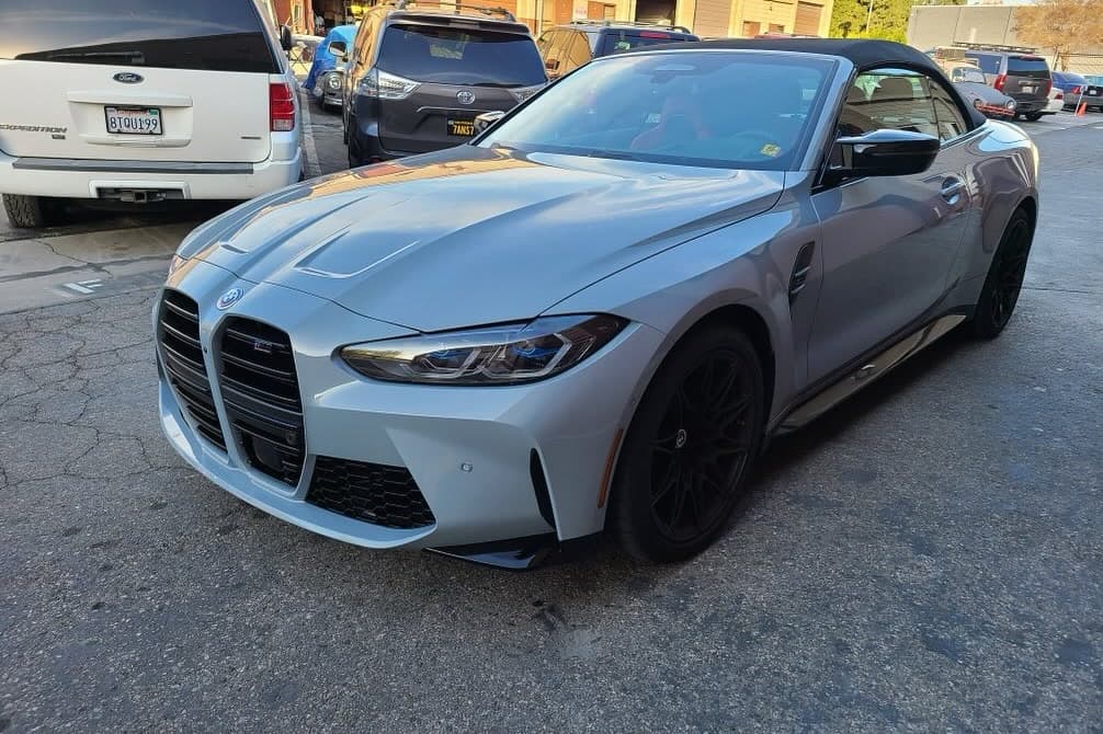 A silver BMW M4 at the shop